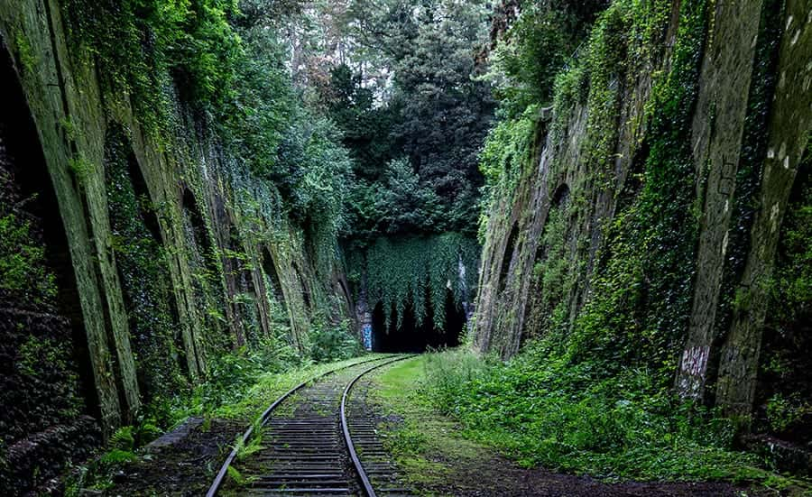 Train tracks leading into tunnel